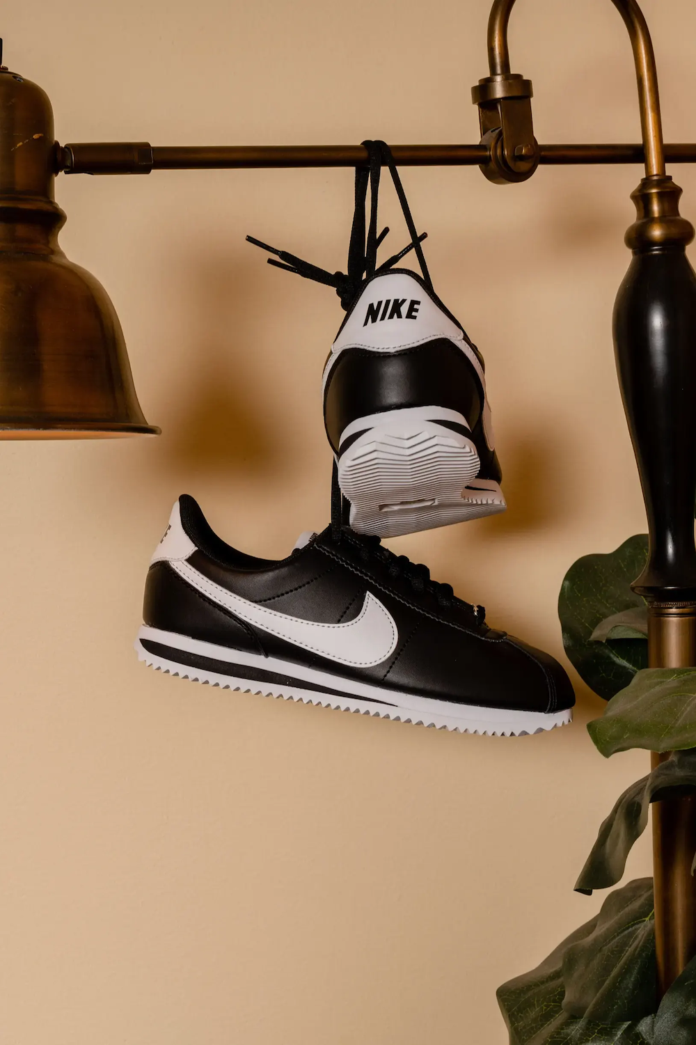 Photo of original black and white Nike Cortez tennis shoes curated by Swagger