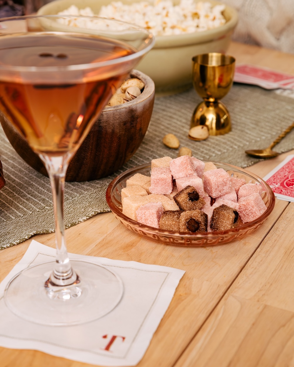Image of Teaspressa’s instant cocktail cubes in a dish with a cocktail-filled martini glass.