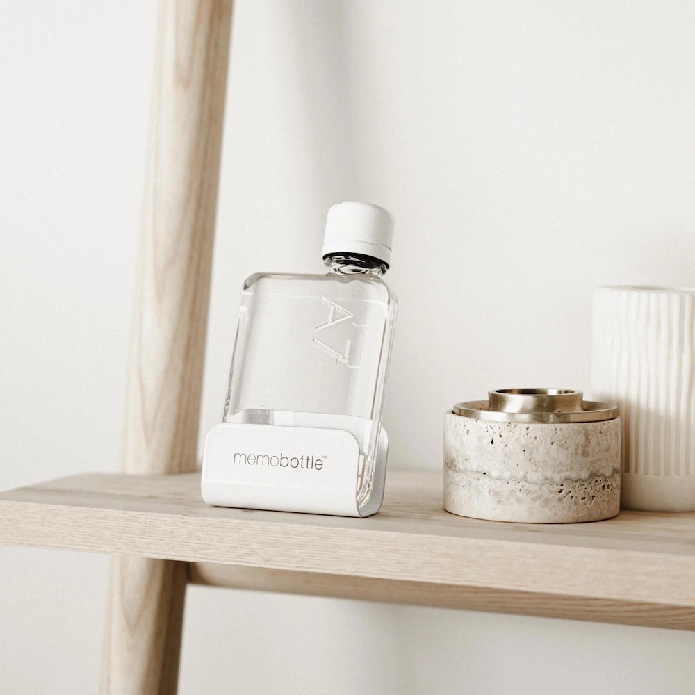 Memo bottle in its holder on a shelf curated by Swagger