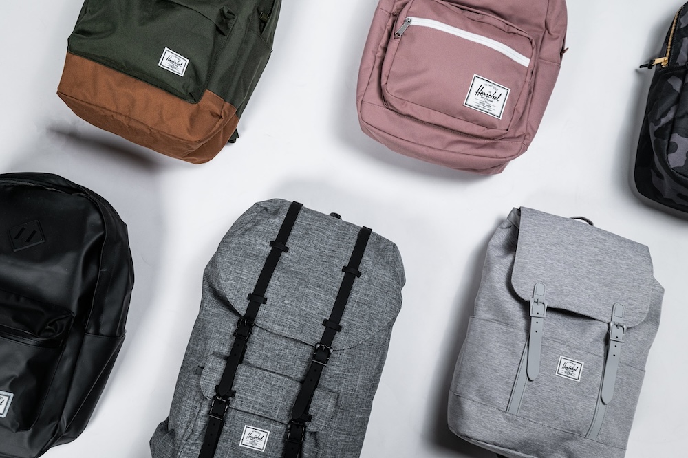 An assortment of Herschel backpacks curated, designed, and custom branded by Swagger.