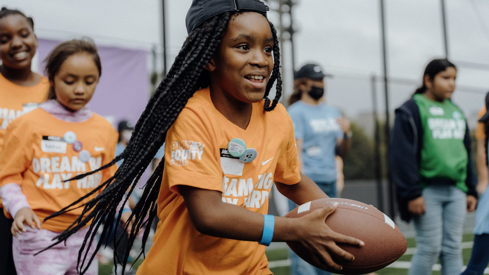 Image of one of Nike's community engagement initiatives, supporting young athletes.