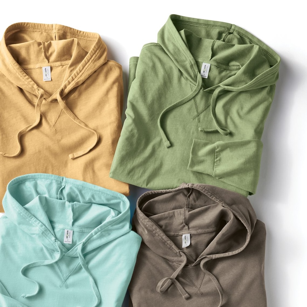 Image of four colors of Allmade’s Unisex Organic French Terry Pullover Hoodie custom branded by Swagger