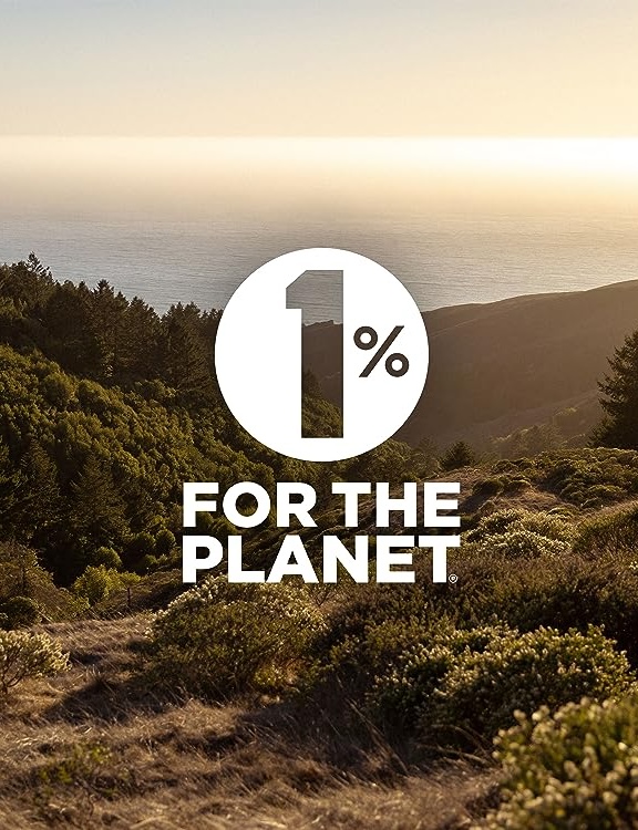 1% For the Planet logo overlaid over a landscape photo of a field with wild bushes and trees with a sunset beginning over the ocean.