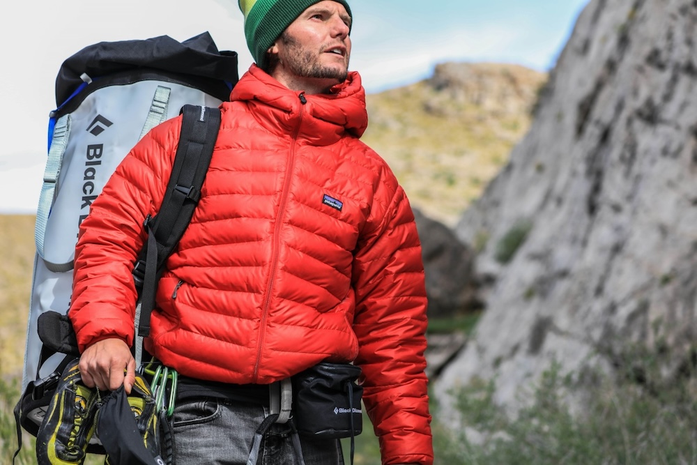 Person wearing a custom branded Patagonia Nano Puff jacket by Swagger.